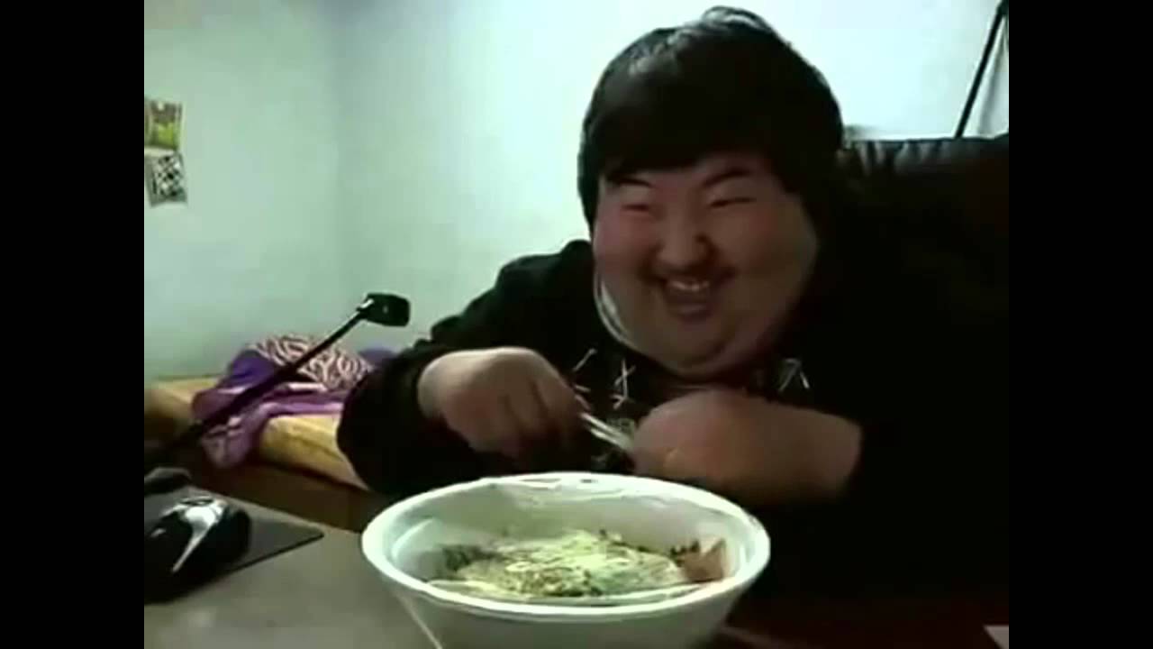 Asian man laughing