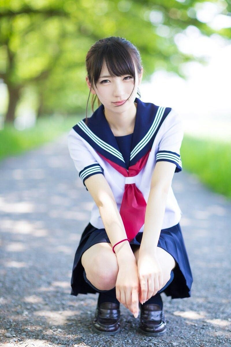 Pretty Asian teen in school uniform