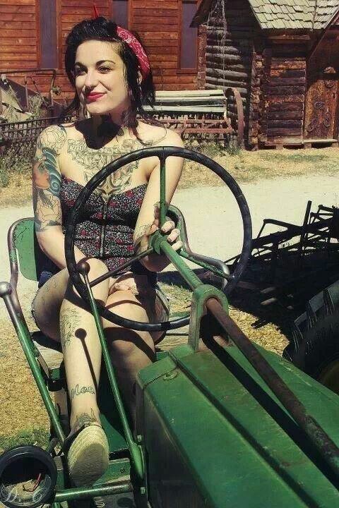 Large breasted women on tractor