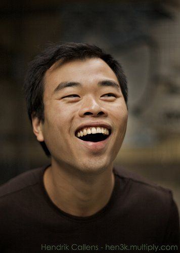 Asian man laughing