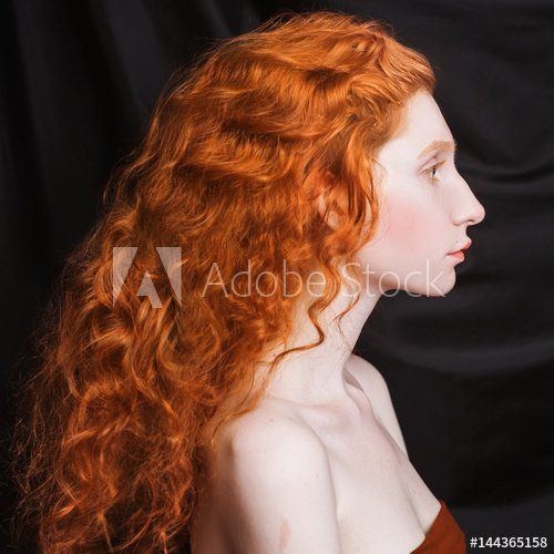 Curly pale redhead