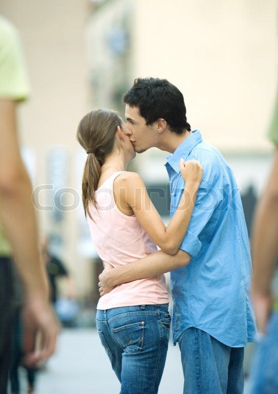 Teenage boys and girls kissing